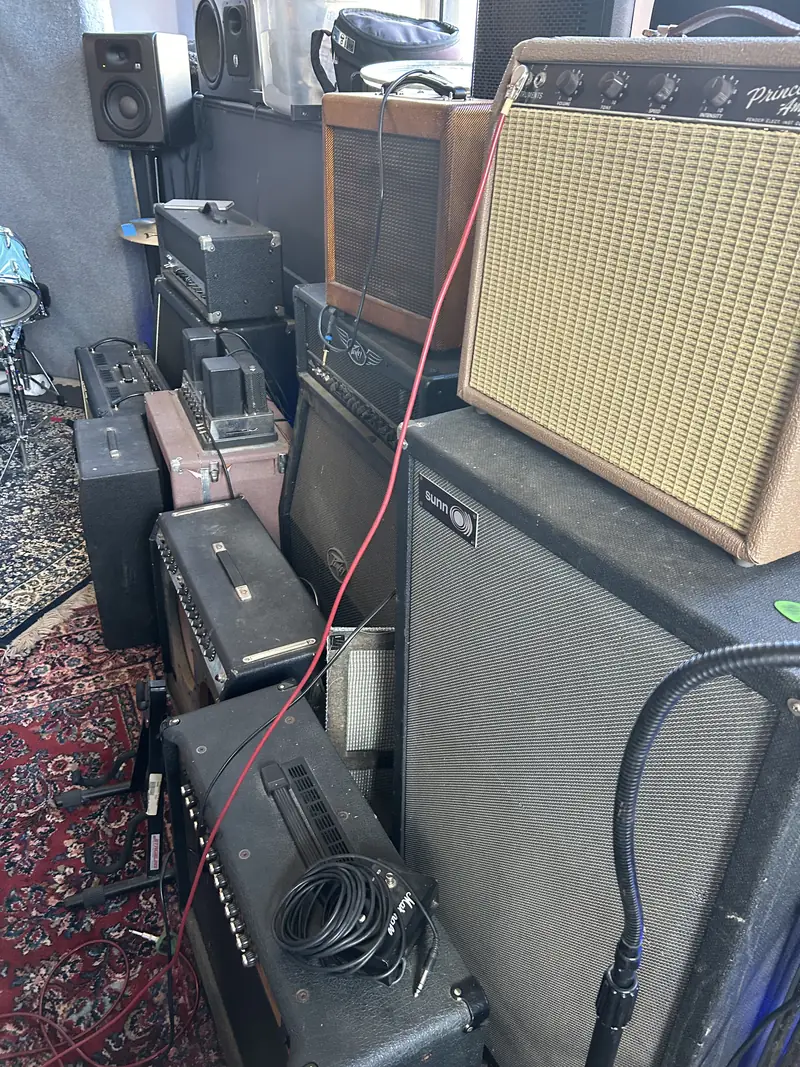 Wall of vintage and modern guitar and bass amps